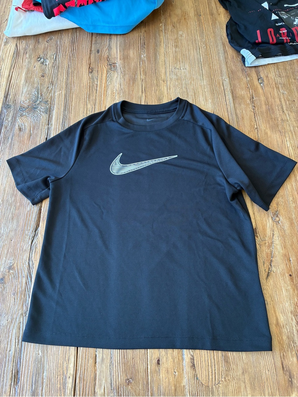 Nike Black Short-Sleeve Athletic Tee with Silver Swoosh